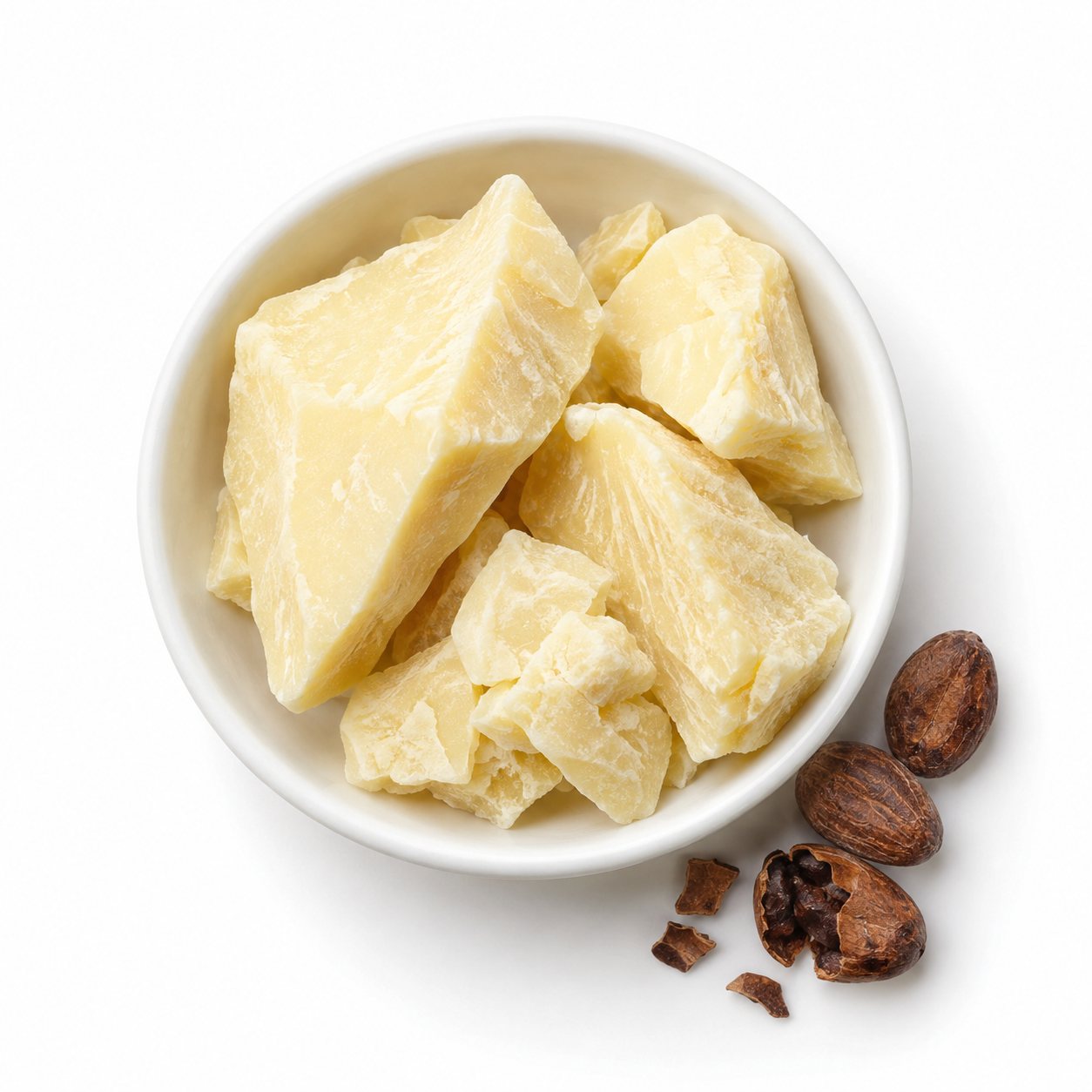 Overhead photograph of cocoa butter with cacao beans on white